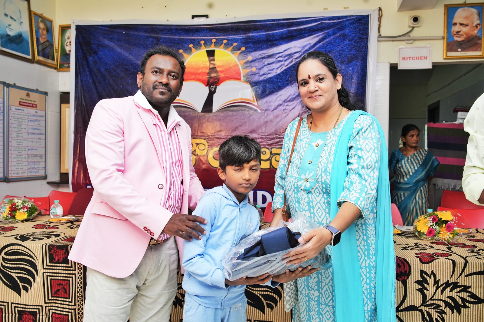 A child receiving a school kit during the Akshara Foundation event